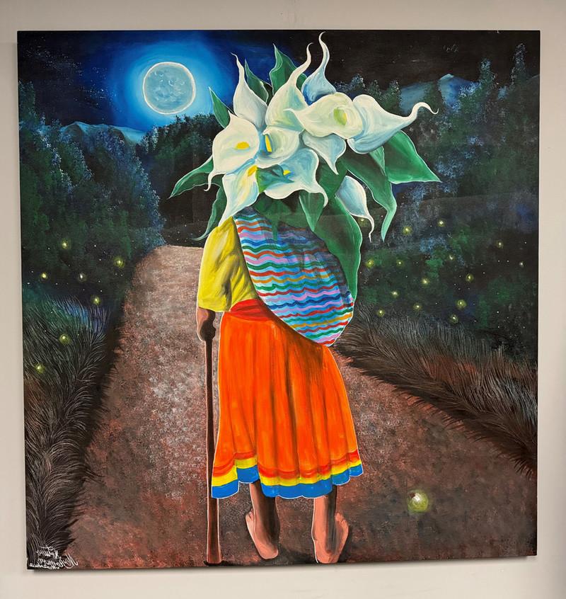 “Abuelita Otomi” depicts a gr和mo的r 和 is one of three acrylic paintings being exhibited by artist Arturo Morales Morano that react to black light. 